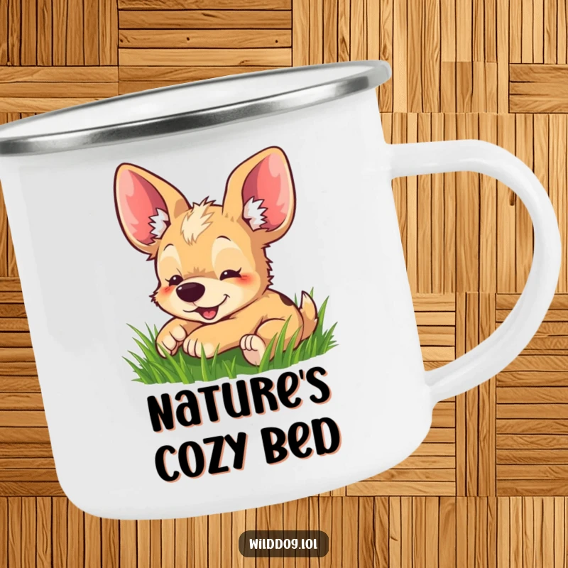 Funny camping mug showing an adorable wild dog with large ears playfully rolling in green grass, ideal for outdoor use.