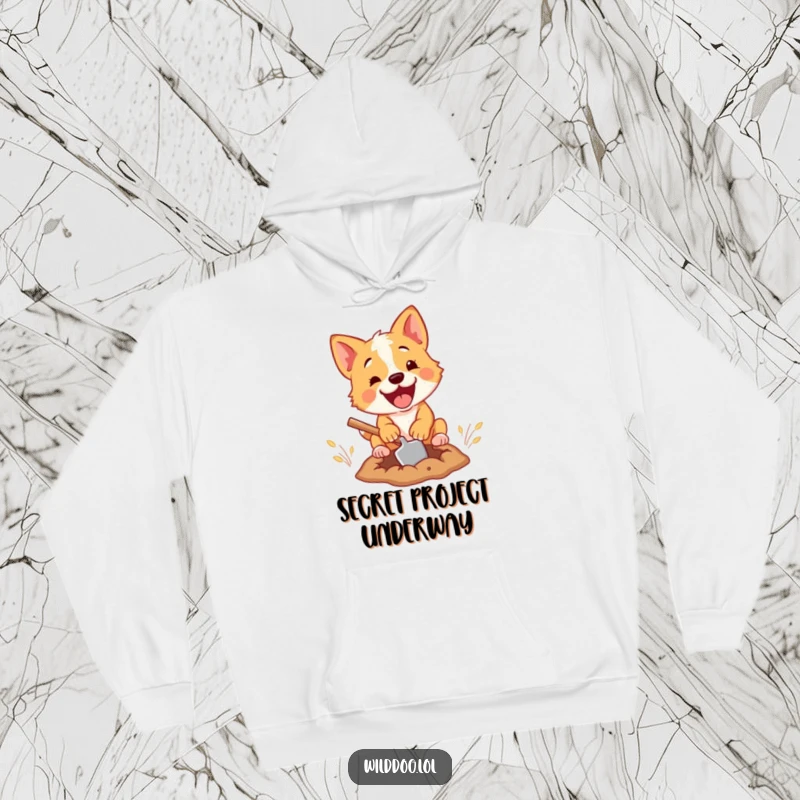 Funny hoodie graphic of a passionate wild dog intently digging a hole with a charmingly small shovel, radiating comedic effort.